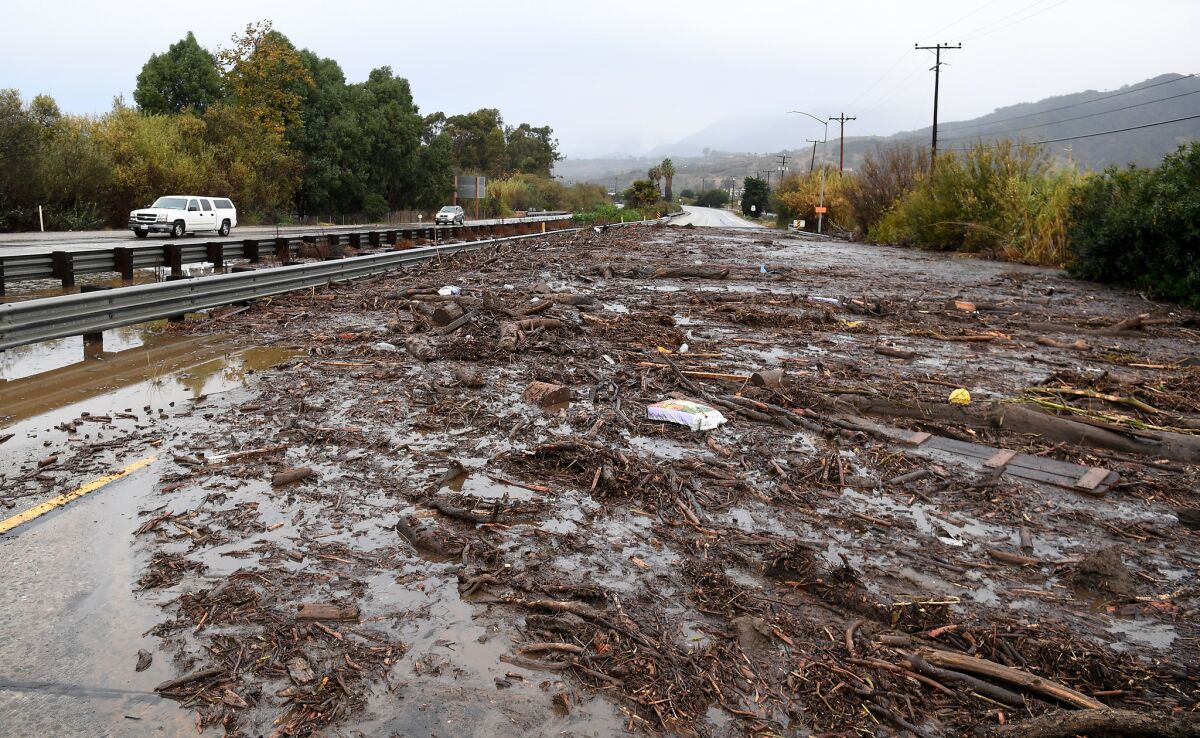 A view of the Northbound 101 freeway in Carpinteria as mud sits along the road from a rain storm Tuesday morning.