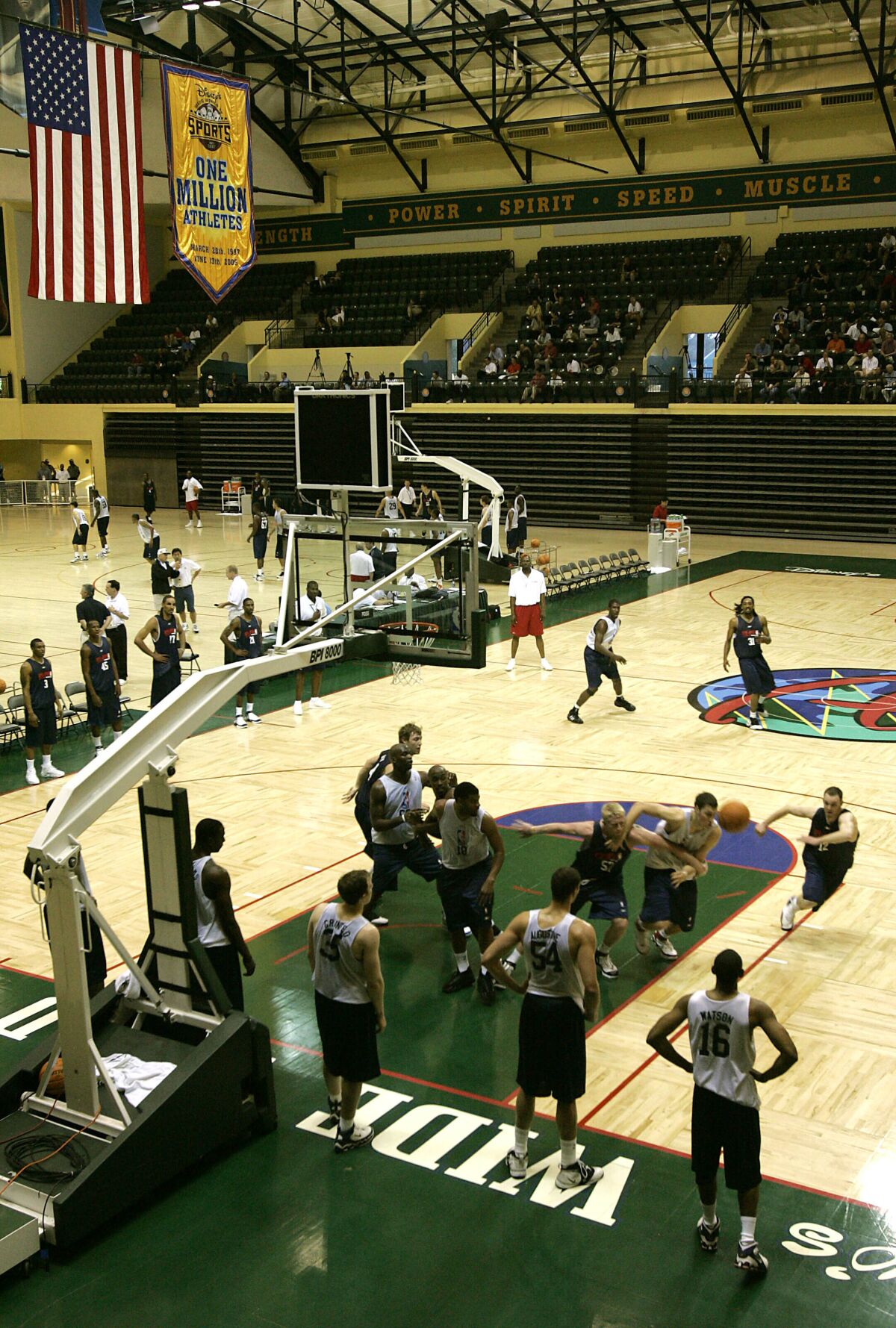 FILE - In this June 6, 2006, file photo, college players scrimmage during an NBA pre-draft basketball camp at the Disney Wide World of Sports complex in Kissimmee, Fla. Most of the 22 remaining NBA teams were taking the court for the first mandatory workouts in nearly four months Wednesday, July 1, 2020, as the league continued prepping for the restart of the season at the Disney campus near Orlando, Florida. Workouts are still individual in nature, but are no longer voluntary. (AP Photo/John Raoux, File)