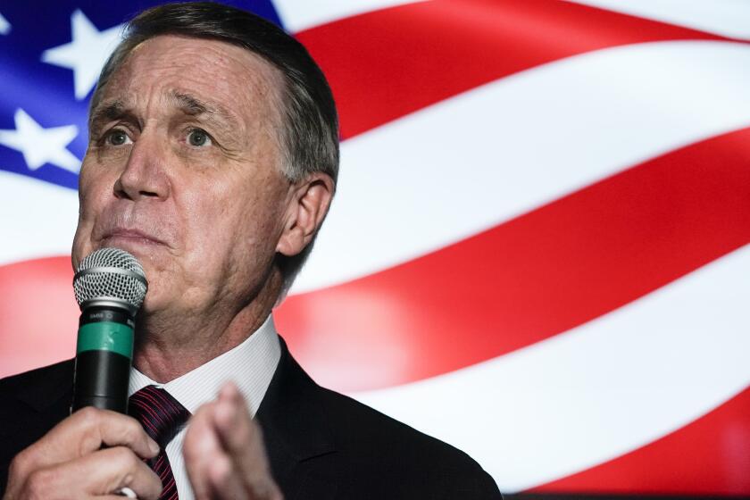 Republican candidate for U.S. Senate Sen. David Perdue speaks during a campaign rally on Friday, Nov. 13, 2020, in Cumming, Ga. Perdue and Democratic candidate Jon Ossoff are in a runoff election for the Senate seat in Georgia. (AP Photo/Brynn Anderson)