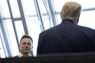 FILE - Tesla and SpaceX CEO Elon Musk talks with President Donald Trump, May 30, 2020, in Cape Canaveral, Fla. (AP Photo/Alex Brandon, File)