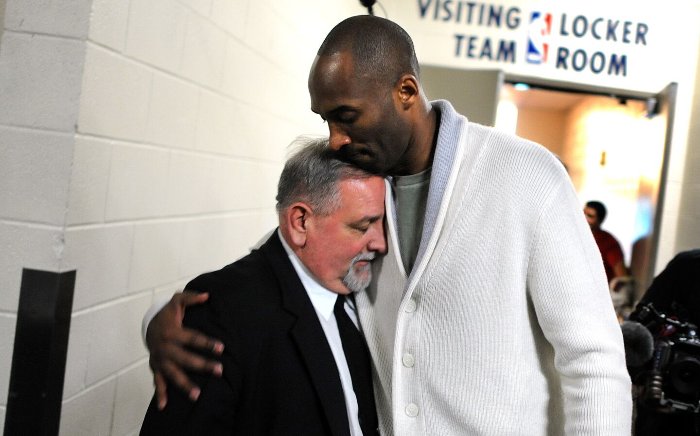 Laker Kobe Bryant hugs security guard Salvatore Chillemi after a game against the Rockets in Houston.