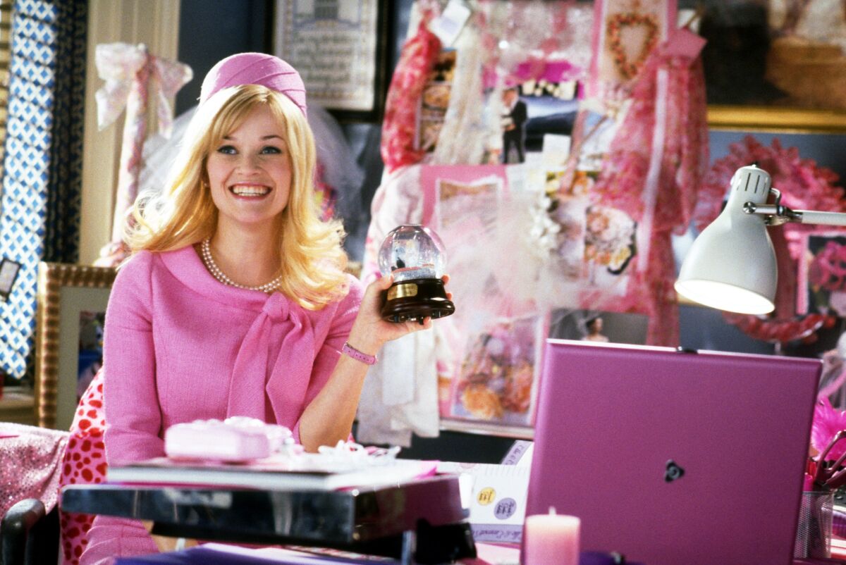 Reese Witherspoon is seen in a pink suit and hat as Elle Woods in the film   "Legally Blonde 2."