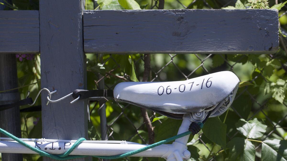 A ghost bike is displayed June 8 as a memorial in Cooper Township, Mich., where five bicyclists where killed and four were injured by an oncoming vehicle.