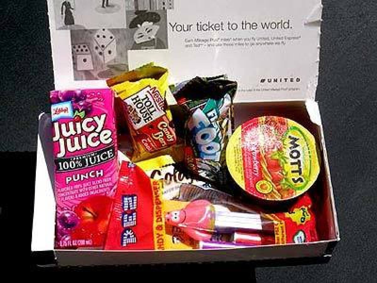 United's Funpack, which sells for $5, includes strawberry applesauce, candy, fruit roll-up and juice.