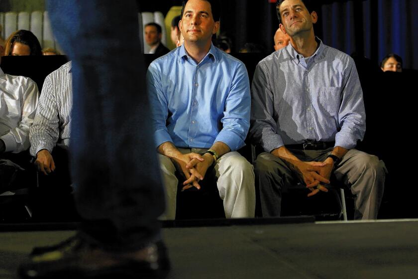 Wisconsin Gov. Scott Walker, left, and Rep. Paul Ryan appear together at a campaign event for former presidential candidate Mitt Romney in June 2012. Walker and Ryan are both possible contestants in the 2016 presidential election.