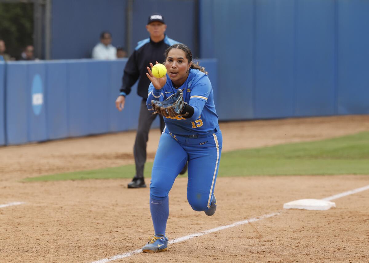 UCLA third baseman Jordan Woolery charges forward to field the ball.