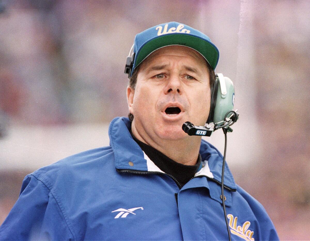 UCLA coach Bob Toledo directs the Bruins during the first half of their 36-24 win over Washington on Nov. 14, 1998.