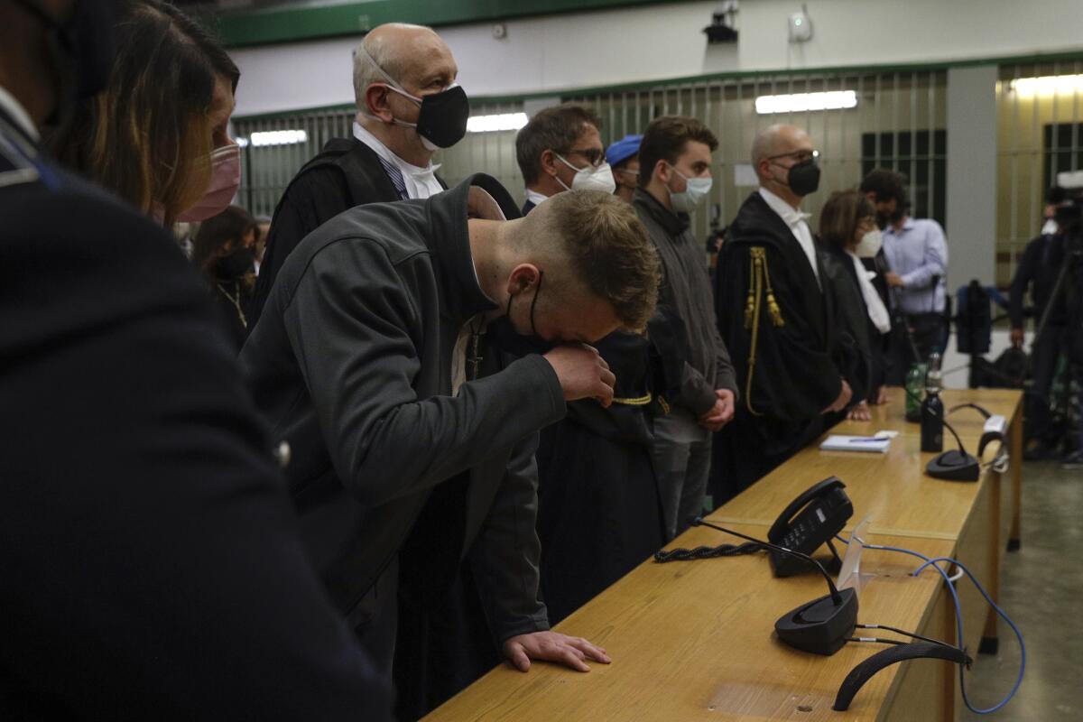 Finnegan Lee Elder listens as the verdict is read, in the trial for the slaying of an Italian plainclothes police officer in summer 2019, in Rome, Wednesday, May 5, 2021. A jury in Rome on Wednesday convicted two American friends in the 2019 slaying of a police officer in a drug sting gone awry, sentencing them to life in prison. The jury deliberated more than 12 hours before delivering the verdicts against Finnegan Lee Elder, 21, and Gabriel Natale Hjorth, 20, handing them Italy's stiffest sentence. (AP Photo/Gregorio Borgia)