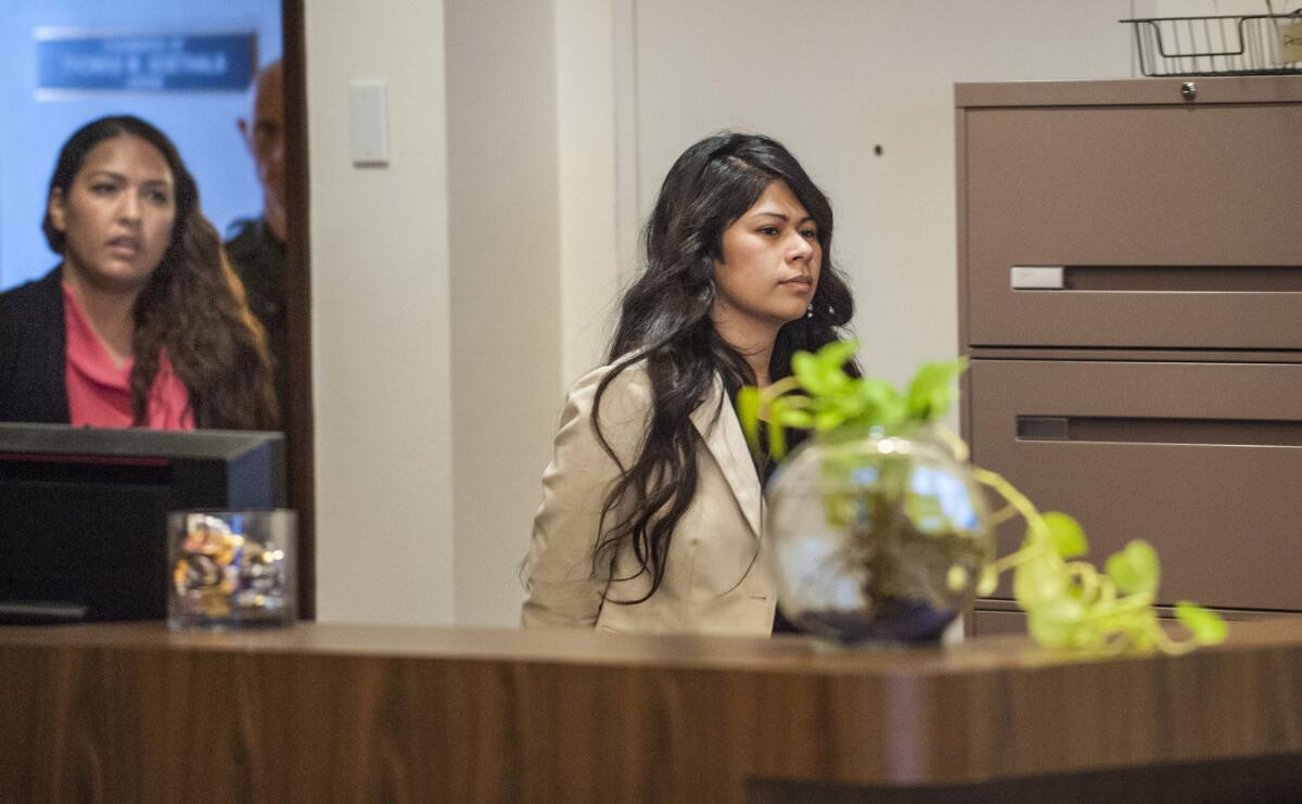 Candace Brito, left, and Vanesa Zavala, charged with murder in the death of Kim Pham, enter court in Santa Ana.