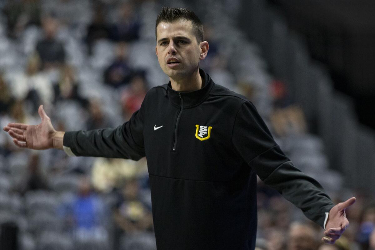 FILE - San Francisco head coach Todd Golden reacts to a referee's call during the second half of an NCAA semifinal college basketball game against Gonzaga at the West Coast Conference tournament March 7, 2022, in Las Vegas. To the core Golden knew his University of San Francisco team had done enough to earn an NCAA Tournament berth. It is just the coach had counted on a No. 9 seed and those were all gone with just four spots in the bracket remaining when the Dons were finally called. (AP Photo/Ellen Schmidt, File)