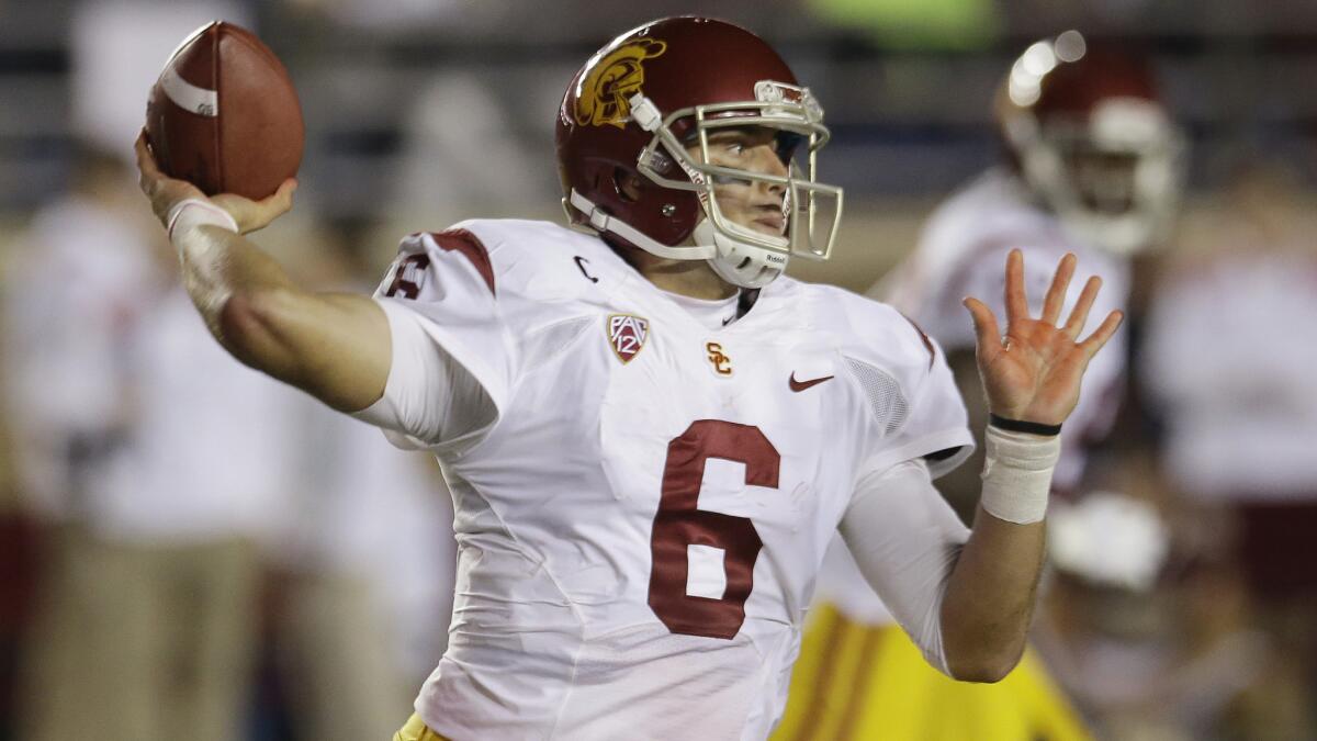 USC quarterback Cody Kessler throws a pass during the Trojans' loss to Boston College on Saturday. Kessler was sacked five times by the Eagles in the loss.
