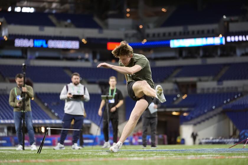 FILE - Arkansas kicker Cameron Little runs a drill at the NFL football scouting combine, Sunday, March 3, 2024, in Indianapolis. The Jacksonville Jaguars are now counting on the youngest kicker ever drafted, Cam Little of Arkansas, to stop a revolving door and bring stability to a position that has been one of the league’s most tumultuous over the last four years. (AP Photo/Michael Conroy, File)