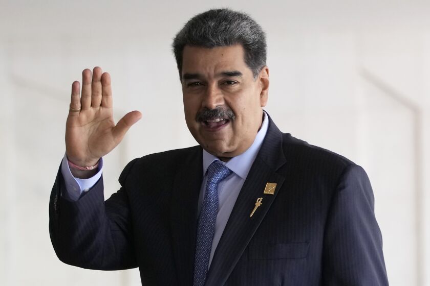 FILE - Venezuela's President Nicolas Maduro waves upon arrival for the South American Summit at Itamaraty palace in Brasilia, Brazil, on May 30, 2023. Maduro arrived late Sunday, June 4, 2023 in the Red Sea city of Jeddah, where he was greeted by Saudi officials, according to the state-run Saudi Press Agency. (AP Photo/Andre Penner, File)