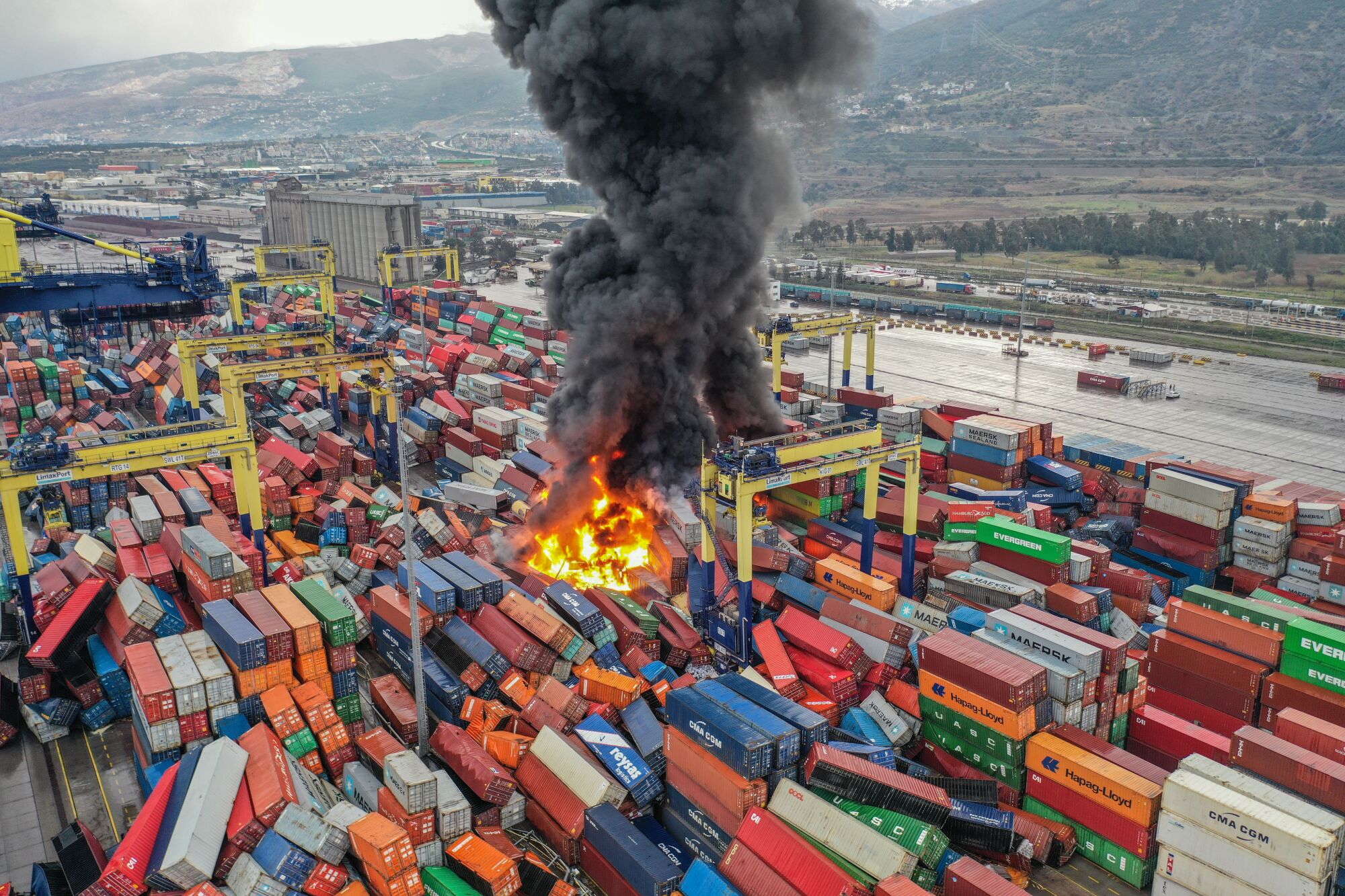 An aerial view of fire in overturned containers following the magnitude 7.8 earthquake in Hatay, Turkey.