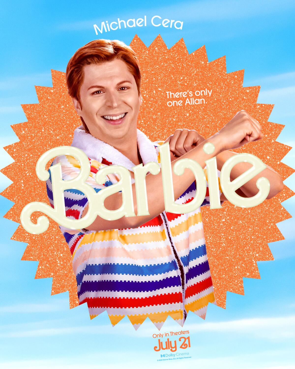 Michael Cera smiles and lightly crosses his arms in a "Barbie" movie poster. He wears a colorful striped shirt.