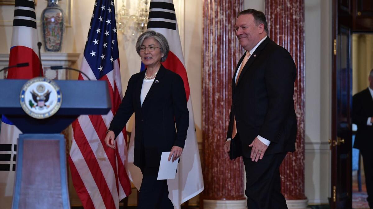 U.S. Secretary of State Mike Pompeo and South Korean Foreign Minister Kang Kyung-wha arrive at a joint news conference at the State Department on Friday.