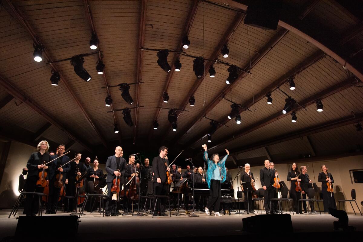 Ojai Festival music director, pianist Mitsuko Uchida takes a bow with the Mahler Chamber Orchestra 