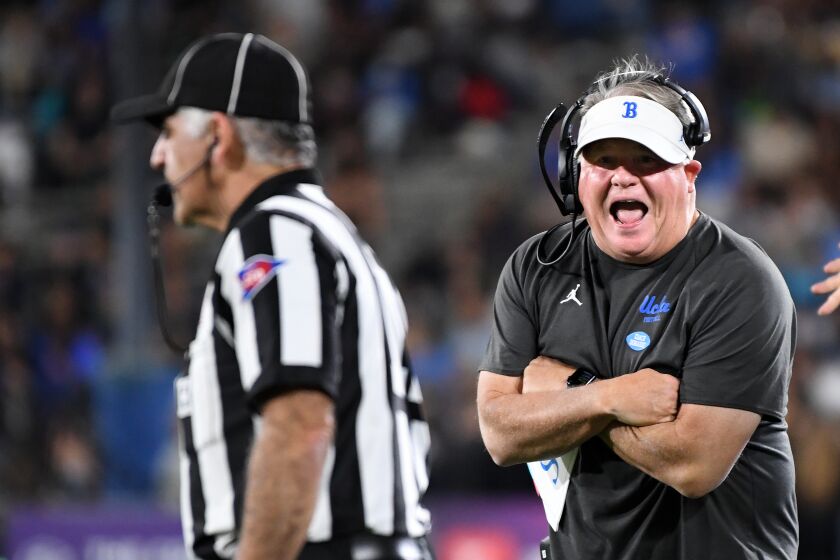 Pasadena, California November 13, 2021: UCLA had coach Chip Kelly has a few words for a referee in the second quarter at the Rose Bowl Saturday. (Wally Skalij/Los Angeles Times)