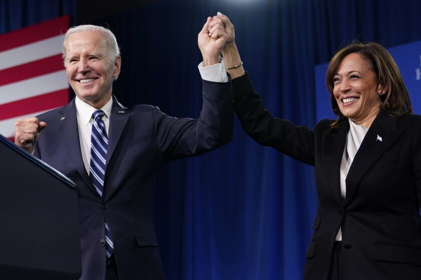 FILE - President Joe Biden and Vice President Kamala Harris stand on stage at the Democratic National Committee winter meeting, Feb. 3, 2023, in Philadelphia. A majority of Democrats now think one term is plenty for Biden, despite his insistence that he plans to seek reelection in 2024. That's according to a new poll from The Associated Press-NORC Center for Public Affairs Research.(AP Photo/Patrick Semansky)
