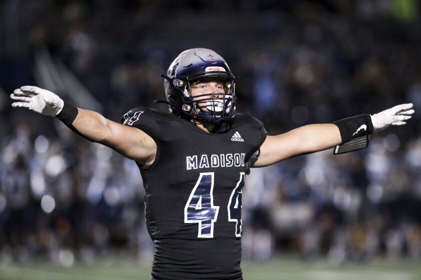 San Diego, CA - September 23: Madison's Lawson Minshew (44) celebrates during their game against Granite Hills at Madison High School on Friday, Sept. 23, 2022 in San Diego, CA. (Meg McLaughlin / The San Diego Union-Tribune)