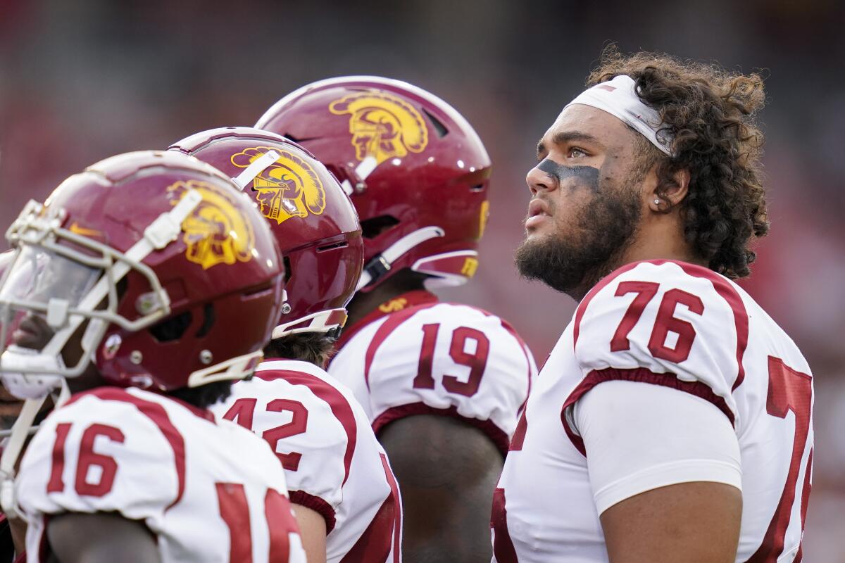 USC offensive lineman Mason Murphy (76) and teammates look up to the scoreboard during a win over Stanford on Sept. 10.