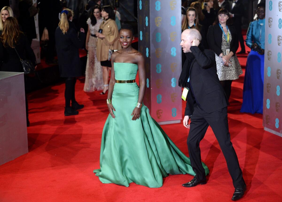 Lupita Nyong'o's green Dior couture gown stands out on the red carpet Sunday at the 2014 BAFTA Awards in London.