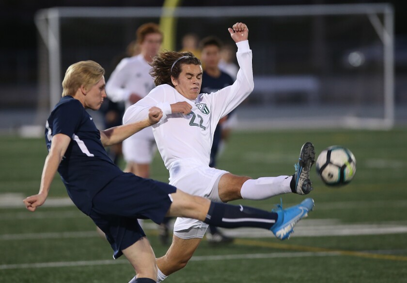 Edison’s Grayson Marquez (22) tries to get to a ball before Newport Harbor’s Jayson Hayward during a match in 2020.