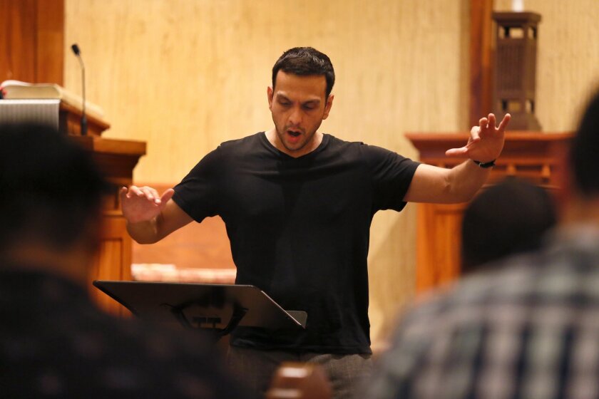 Krishan Oberoi conducts a rehearsal of Sacra/Profana as it prepares for performances during Comic-Con. Photo: Nancee E. Lewis