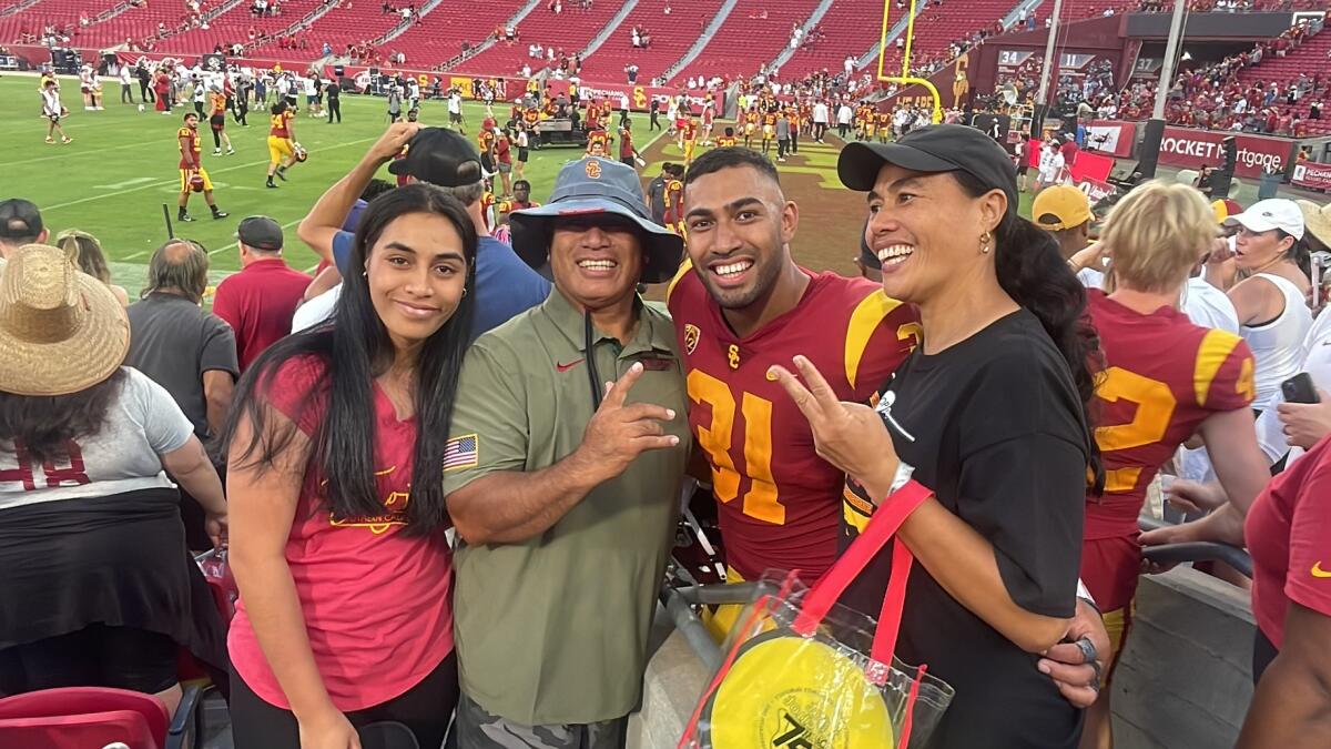 Qudaela Taleni, Jack Taleni, Tyrone Taleni and Lise Taleni gather for a picture after the Trojans' win.