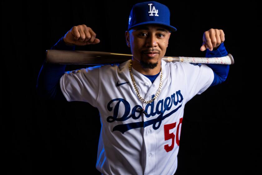 Dodgers outfielder Mookie Betts (50) poses for a portrait during Spring Training photo day at Camelback Ranch.