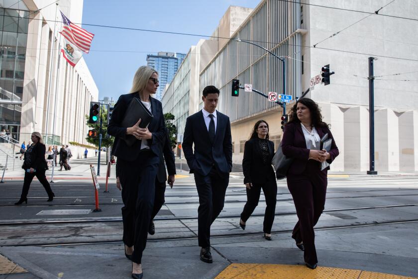 San Diego, CA - April 27: Matt Araiza, center, leaves the San Diego Superior Courthouse on Thursday, April 27, 2023 in San Diego, CA. A judge ruled that videos related to the SDSU gang rape case should be made available to media(Adriana Heldiz / The San Diego Union-Tribune)