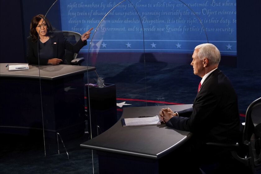 Democratic vice presidential candidate Sen. Kamala Harris, D-Calif., gestures toward Vice President Mike Pence during the vice presidential debate Wednesday, Oct. 7, 2020, at Kingsbury Hall on the campus of the University of Utah in Salt Lake City. (AP Photo/Morry Gash, Pool)