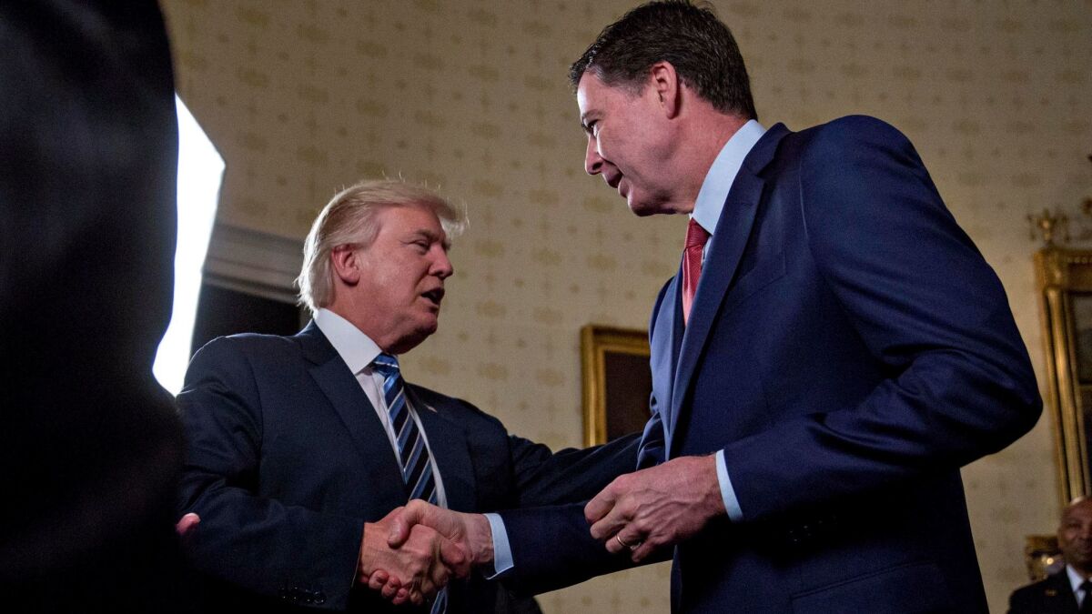 Trump and Comey at the White House on Jan. 22. (Getty Images)