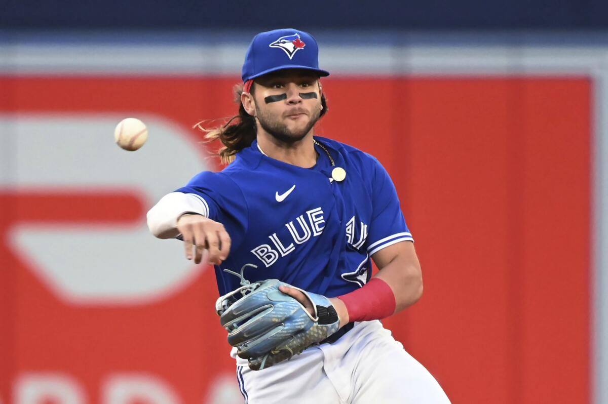 RED SOX: Blue Jays blow lead in 9th, win in 10th