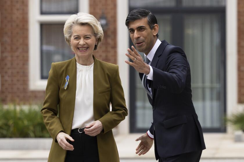 Britain's Prime Minister Rishi Sunak, right, greets European Commission President Ursula von der Leyen at the Fairmont Hotel in Windsor, England, Monday Feb. 27, 2023. The U.K. and the European Union were poised Monday to end years of wrangling and seal a deal to resolve their thorny post-Brexit trade dispute over Northern Ireland. Striking an agreement at a meeting with European Commission President Ursula von der Leyen would be a big victory for Prime Minister Rishi Sunak — but not the end of his troubles. (Dan Kitwood/Pool via AP)