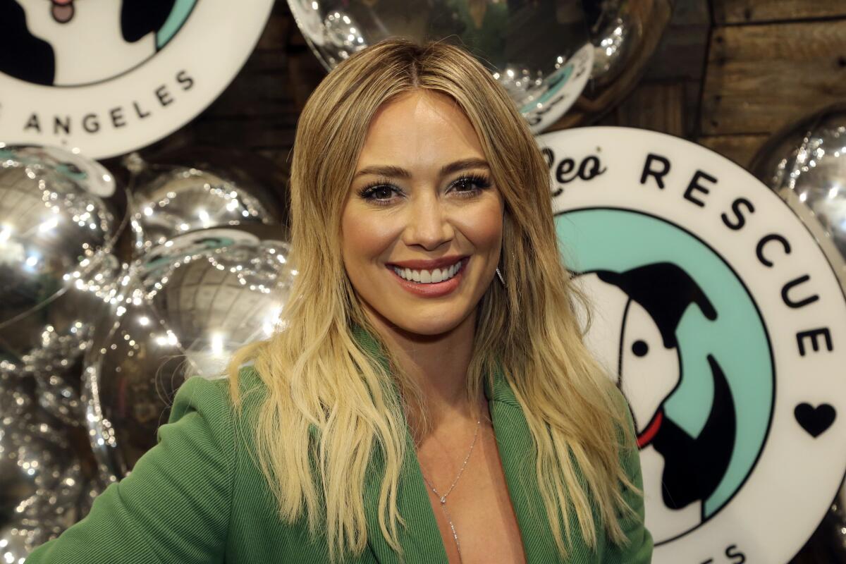 Actor Hilary Duff in a green jacket