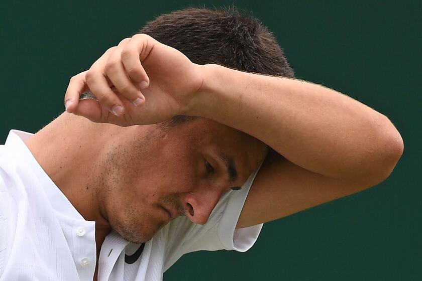 Australia's Bernard Tomic reacts against Germany's Mischa Zverev during their men's singles first round match on the second day of the 2017 Wimbledon Championships at The All England Lawn Tennis Club in Wimbledon, southwest London, on July 4, 2017. Zverev won the match 6-4, 6-3, 6-4. / AFP PHOTO / Justin TALLIS / RESTRICTED TO EDITORIAL USEJUSTIN TALLIS/AFP/Getty Images ** OUTS - ELSENT, FPG, CM - OUTS * NM, PH, VA if sourced by CT, LA or MoD **