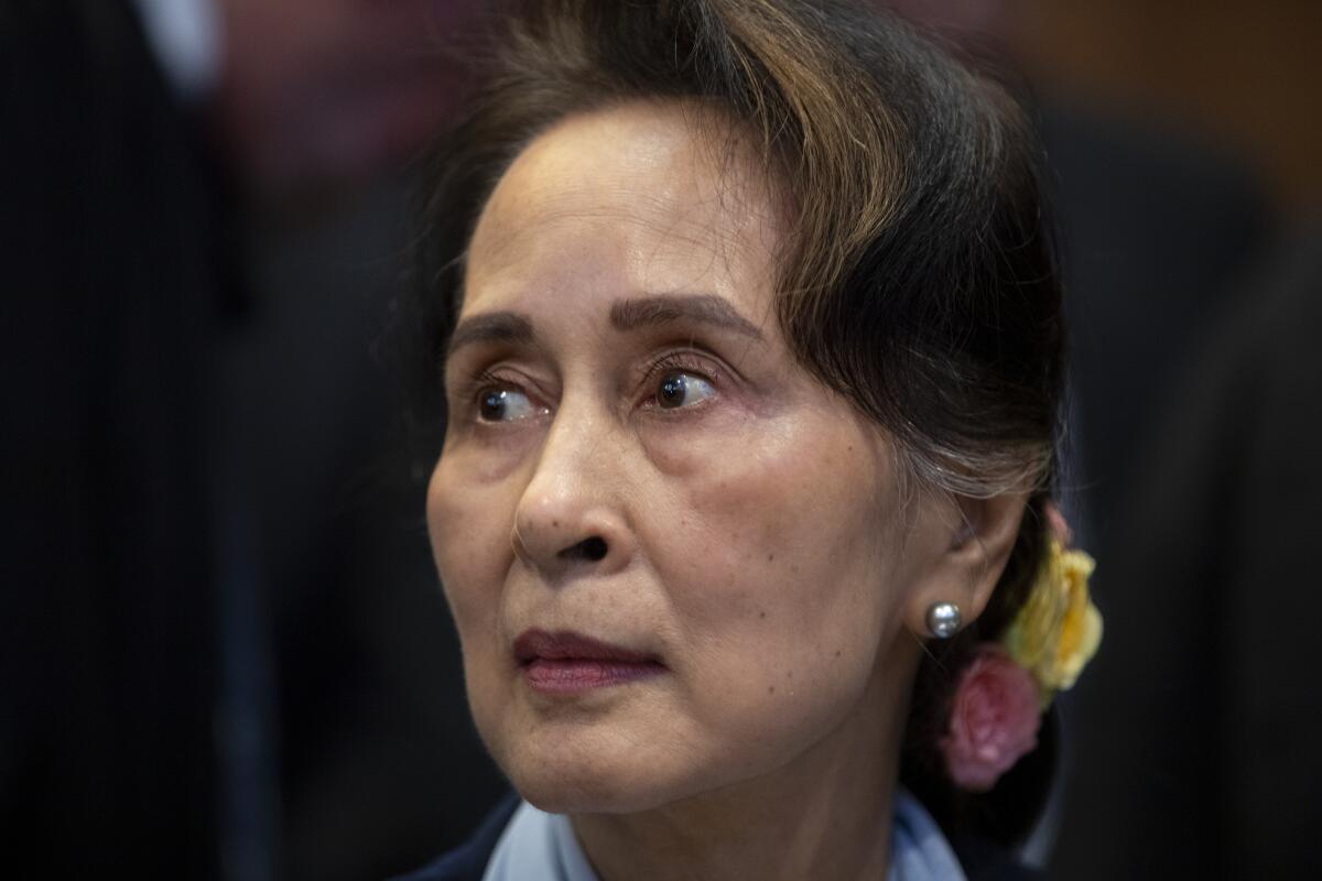 FILE - Myanmar's leader Aung San Suu Kyi waits to address judges of the International Court of Justice in The Hague, Netherlands, Dec. 11, 2019. Myanmar’s ousted leader Aung San Suu Kyi has testified in a prison courtroom in the capital Naypyitaw for the first time in her official secrets case. Suu Kyi, who has been detained since her government was ousted last year by the military, is being tried with Australian economist Sean Turnell and three former Cabinet members on the same charge, which is punishable by up to 14 years in prison. (AP Photo/Peter Dejong, File)
