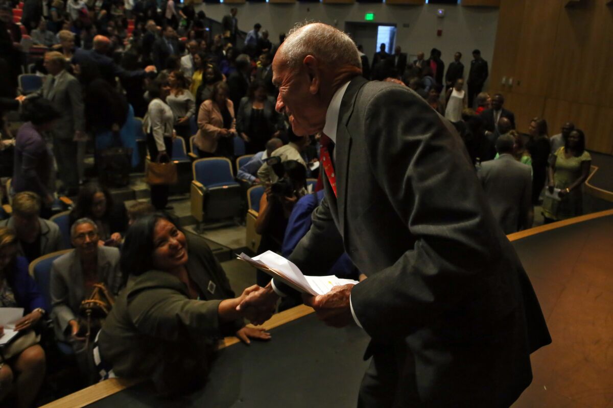 L.A. schools Supt. Ramon C. Cortines, right, greets school board member Monica Garcia after his annual address on Tuesday to administrators.