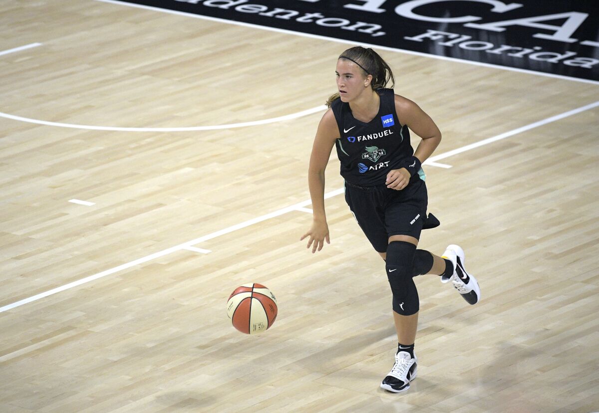 FILE - In this July 25, 2020, file photo, New York Liberty guard Sabrina Ionescu brings the ball up during the second half of the team's WNBA basketball game against the Seattle Storm in Bradenton, Fla. Ionescu is excited to be playing basketball again nearly eight months after spraining her ankle early in her rookie season with the Liberty. (AP Photo/Phelan M. Ebenhack, File)