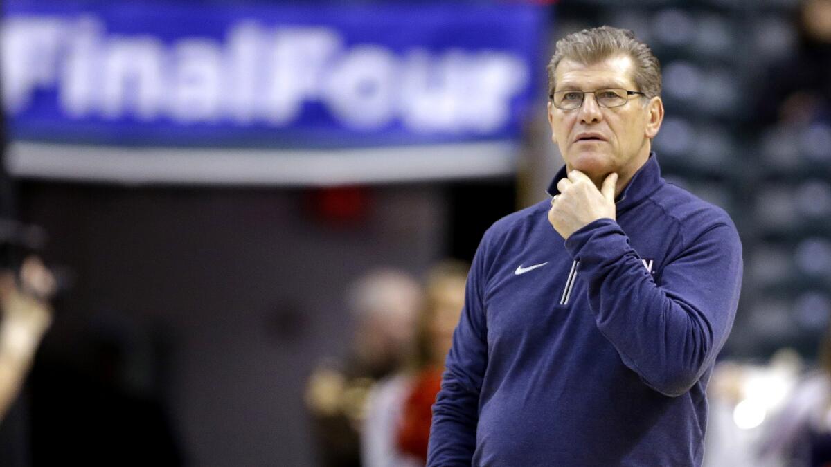Connecticut Coach Geno Auriemma watches his team's pracatice on Saturday in Indianapolis.