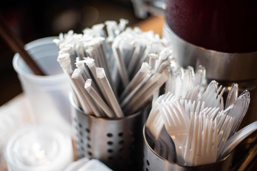 Plastic straws wrapped in paper and plastic forks are seen at a food hall in Washington DC on June 20, 2019. - “How do you drink a milkshake without a straw?” The city of Washington has decided, in the name of the environment, to ban plastic drinking straws — an act viewed as almost sacrilegious in the birthplace of this simple but seemingly indispensable part of daily American life.In the last century, millions of straws were produced in the Stone Straw Building, a stolid-looking structure of yellowing brick in a residential neighborhood. The building now houses the capital’s transit police headquarters. The only visible sign of its historic character comes from a discreet commemorative plaque affixed to a wall above a garbage bin that honors the memory of Marvin C. Stone, “Inventor of the Paper Straw.” (Photo by Eric BARADAT / AFP)ERIC BARADAT/AFP/Getty Images ** OUTS - ELSENT, FPG, CM - OUTS * NM, PH, VA if sourced by CT, LA or MoD **