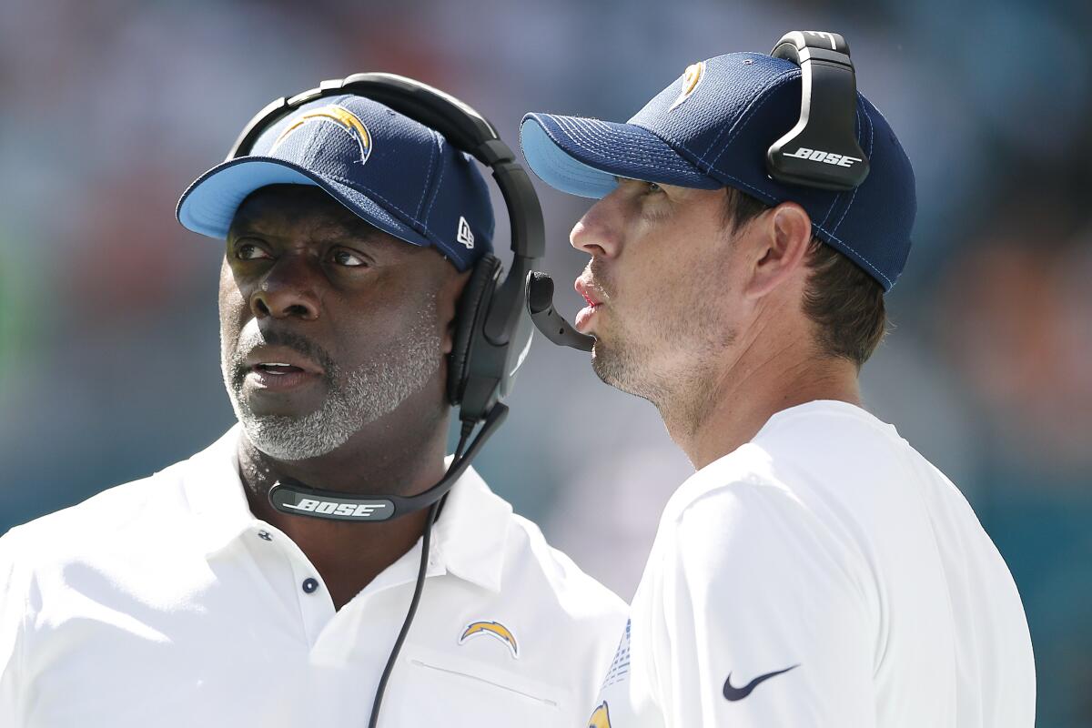 Chargers coaches Anthony Lynn, left, and Shane Steichen during a game against the Dolphins on Sept. 29.