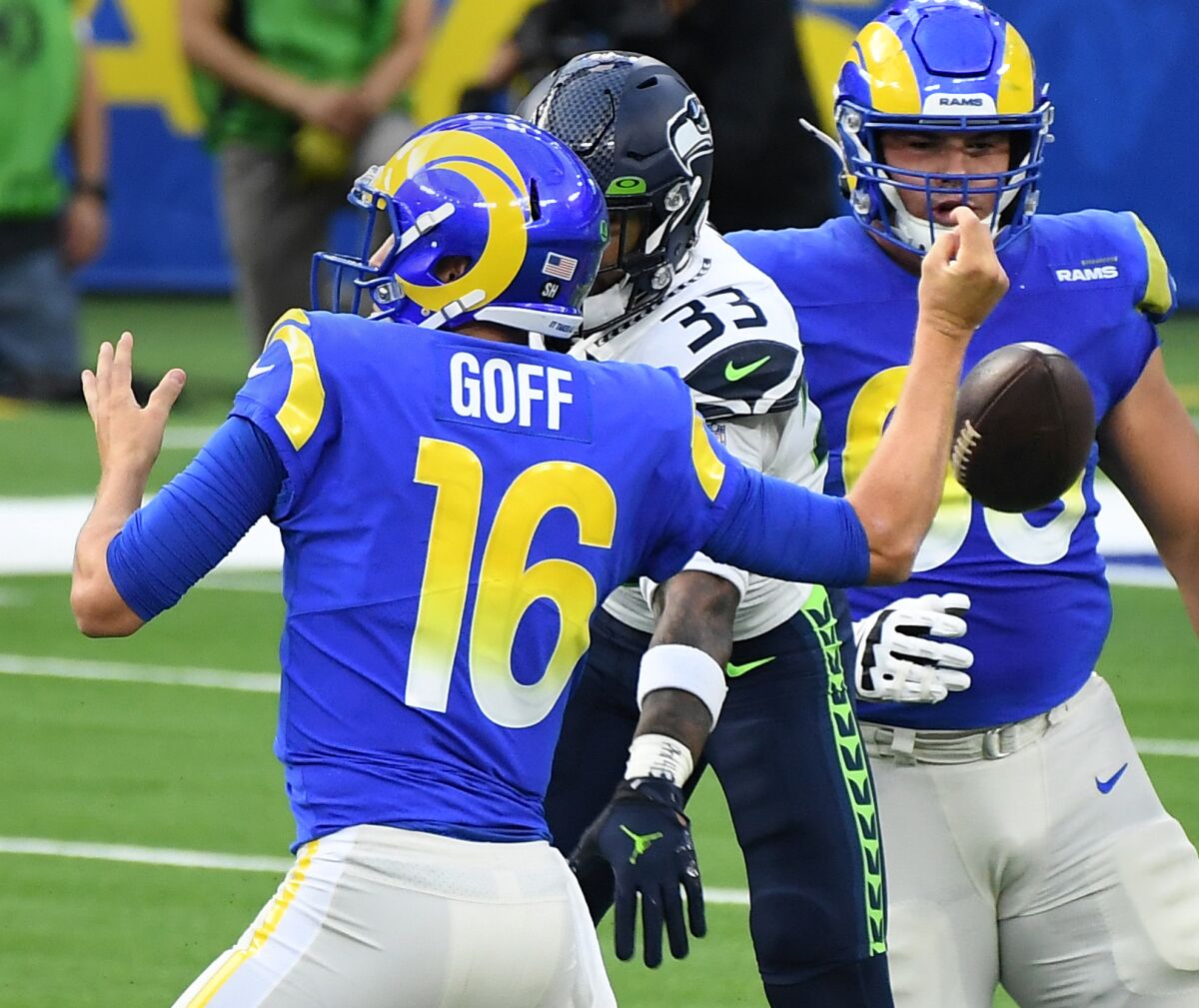 Seattle Seahawks safety Jamal Adams knocks the ball out of Rams quarterback Jared Goff's hand.