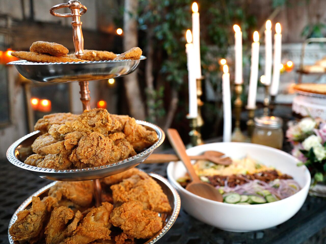 Three tiers of fried chicken -- and a salad -- are ready for the party to begin.