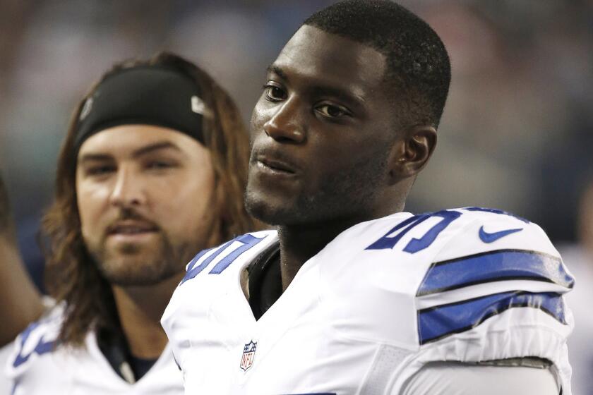 Dallas Cowboys linebacker Rolando McClain stands on the sideline during a preseason game against the Denver Broncos in Arlington, Texas, on Aug. 28, 2014.