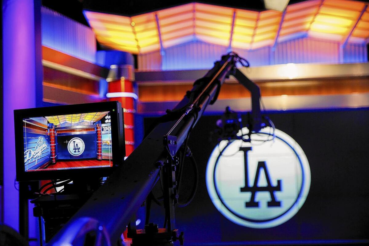 Time Warner Cable wants other pay-TV providers to charge all their customers about $5 a month for the Dodgers channel SportsNet LA. DirecTV, Verizon, AT&T and Dish Network have refused. Above, the SportsNet LA studio.
