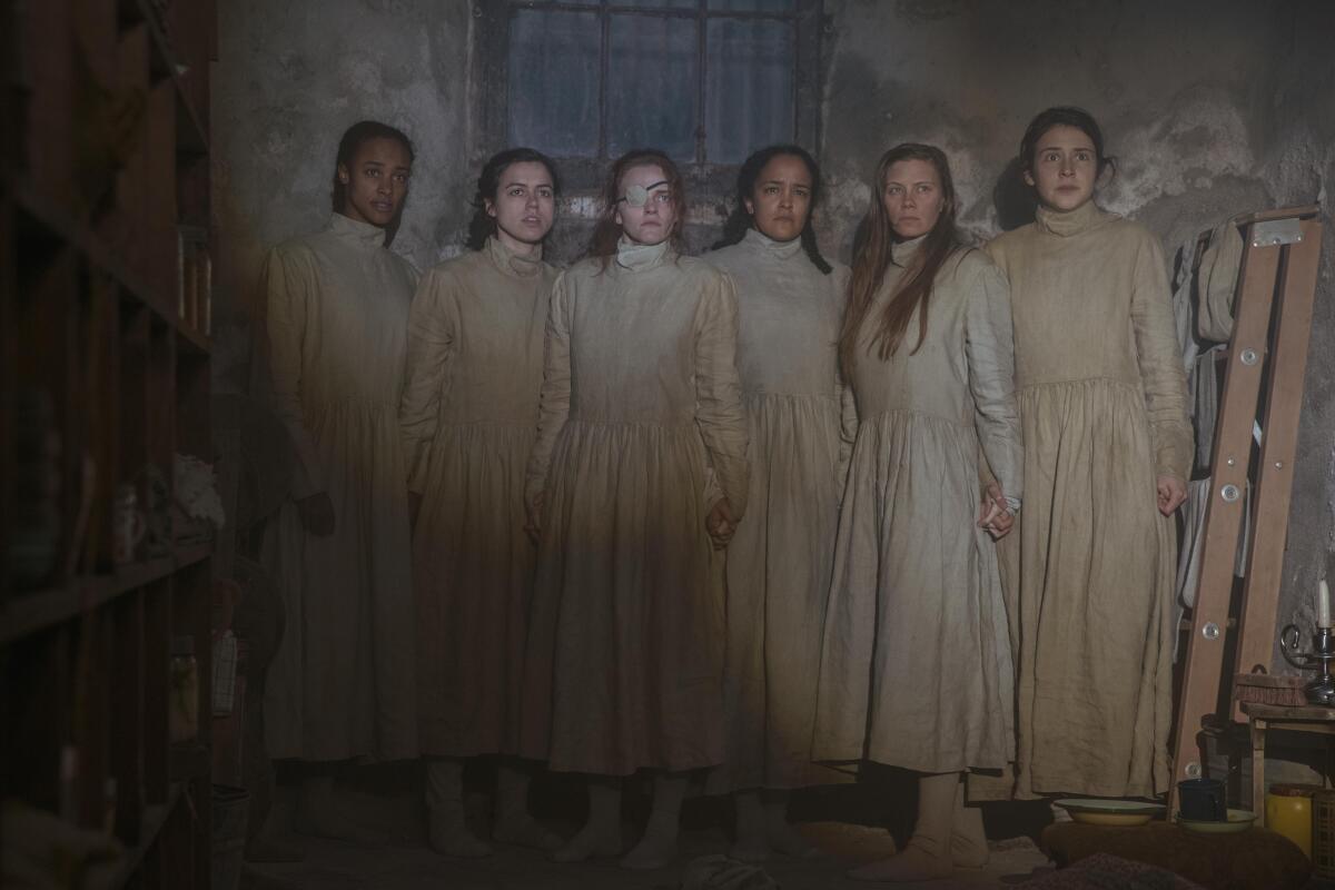 A group of women wear long dresses in "The Handmaid's Tale"