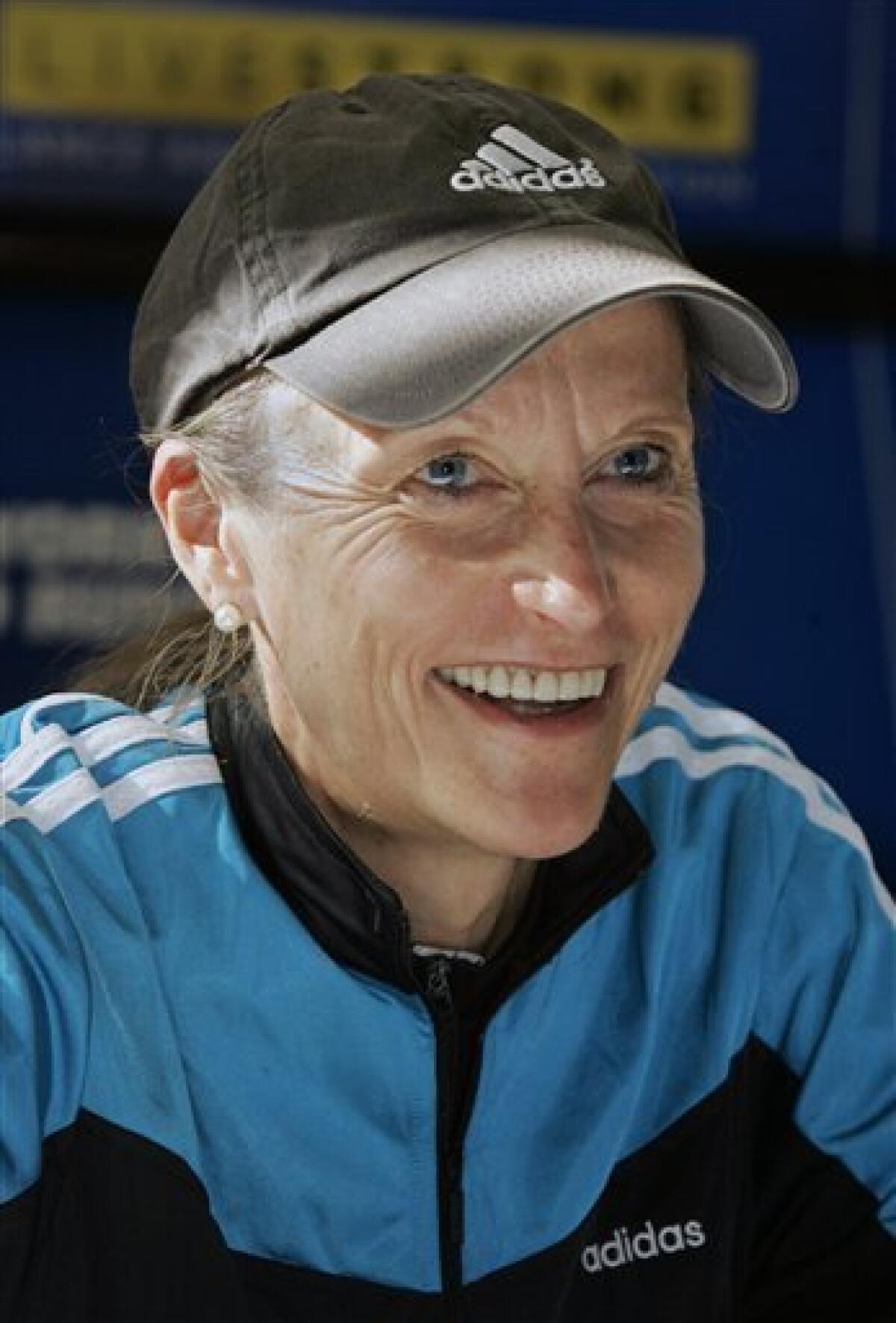 This photo taken Nov. 3, 2006 shows Grete Waitz, nine-time New York City marathon winner, smiles at a New York news conference. A 10-kilometer race next month in Central Park will be dedicated to the Waitz, who died last month at 57 from cancer, as part of a season-long tribute to the winner of a record nine New York City Marathons. (AP Photo/Richard Drew)