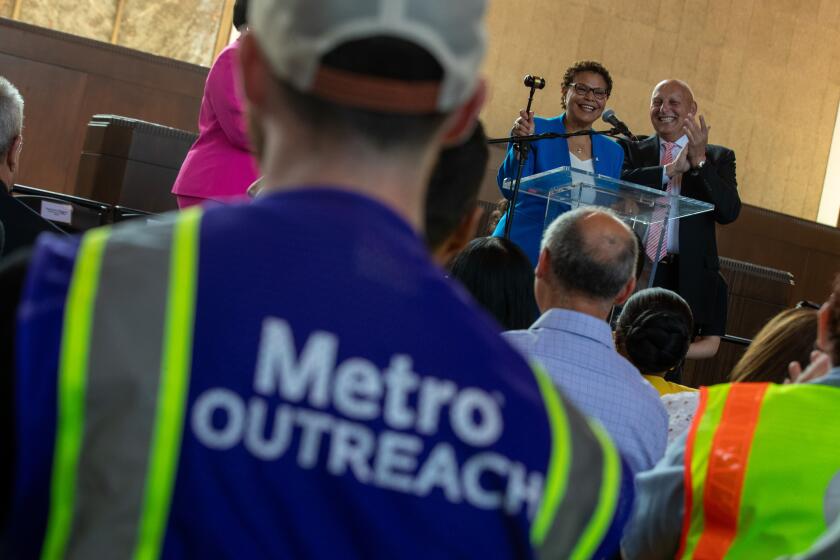 Los Angeles, CA - July 24: Los Angeles Mayor Karen Bass, left, smiles as she takes the gavel from outgoing chair of the Metro Board of Directors Ara Najarian, right, during a program at Union Station on Monday, July 24, 2023 in Los Angeles, CA. (Brian van der Brug / Los Angeles Times)